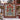 Amaryllis Delft Christmas Tree of Life woven blanket shown outdoors on a snowy farm with a windmill