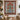 Amaryllis Delft Christmas Tree of Life woven blanket displayed as a wall tapestry above a candlelit dining table