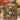Couple holding a personalized Autumn Leaf Stained Glass photo blanket with six family photos and custom family name