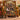 Autumn Leaf Stained Glass family photo blanket draped over a mustard armchair