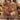 Holding a personalized autumn mum garden woven blanket with custom name woven in