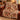 Autumn Stag Pheasant woven blanket draped over a sofa
