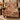 Autumn Stag Pheasant woven blanket draped over an armchair