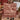 Couple holding a personalized Barn Red Tree Farm Landscape woven blanket with custom names in a kitchen