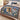 Bethlehem Lily Nativity woven blanket spread across a bed in a Christmas bedroom