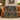 Personalized Midnight Conservatory Library woven blanket draped over a cognac leather sofa