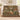 Personalized Secret Garden Almanac woven blanket draped over an ivory sofa