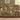Personalized Secret Garden Almanac woven blanket draped over a taupe sofa