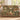 Personalized Secret Garden Almanac woven blanket draped over a green velvet sofa