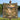 Personalized Shepherd's Homeward Path lamb woven blanket held up outdoors by a lake