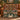Personalized Twelve Days of Christmas pear tree woven blanket draped over a cognac leather sofa