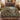 Black Bear Huckleberry Heritage woven blanket spread across a bed in a cozy bedroom