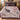 Black Bear Huckleberry Luxe woven blanket spread across a bed in a cozy bedroom