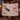 Couple holding a personalized Black Bear Huckleberry Luxe woven blanket with custom family name