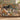 Black Cat & Kitten Rosehip Garden woven blanket draped over a sofa