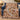 Blue China Christmas Pudding woven blanket draped over a navy armchair