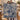 Couple holding a personalized Blue Cream Hanukkah Story woven blanket with custom names woven in