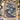 Blue Ivory Christmas Swan woven blanket displayed on a snowy front porch with Christmas garland and lanterns