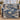 Blue Ivory Christmas Swan woven blanket draped over a blue sofa