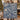 Couple holding a personalized Blue Road to Bethlehem Pattern woven blanket with custom family name