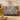 Blue Squirrel Hazelnut Pattern woven blanket draped over a sofa