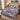 Blue Willow Pheasant Christmas quilt bedding set with 2 matching pillowcases on a bed with holiday decor