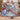 Couple holding a personalized Blue Willow Pheasant Christmas woven blanket with custom family name