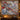 Blue Willow Pheasant Christmas woven blanket displayed as a wall tapestry above a console