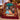 Holding a personalized Christmas musical theatre stage fleece blanket by the fireplace