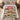 Brown campus quilt bedding set with 2 matching pillowcases on a dorm bed