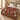 Burgundy Cardinal Bell Garden woven blanket spread across a bed in a Christmas bedroom