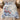 Camellia Snow Bunting Chinoiserie quilt bedding set with 2 matching pillowcases on a bed