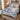 Personalized Camellia Snow Bunting Chinoiserie quilt bedding set with custom name in a cozy bedroom