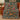 Cardinal gift tree woven blanket draped over a sofa