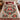 Cardinal wreath woven blanket spread across a bed