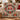 Cardinal wreath woven blanket draped over a sofa