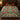 Ceramic Christmas Tree Squirrels woven blanket spread across a bed in a Christmas bedroom