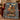 Christmas Carol clockwork woven blanket draped over an armchair