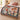 Christmas Carousel Garden woven blanket spread across a bed in a Christmas bedroom