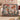 Christmas Carousel Garden woven blanket draped over a sofa in a holiday living room