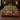 Christmas Cats woven blanket spread across a bed in a Christmas bedroom