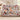 Christmas Dogs Poinsettia woven blanket draped over a sofa in a holiday living room