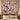 Christmas Dogs Poinsettia woven blanket hanging as a wall tapestry above a bed