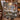 Couple holding a personalized Christmas Eve Reindeer Forest woven blanket with custom family name by a fireplace