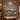 Christmas Eve Reindeer Forest woven blanket displayed as a wall tapestry above a bench in a log cabin
