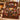 Custom family name Christmas photo blanket draped over an armchair by the fireplace