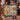 Couple holding the personalized Christmas Music Arcade woven blanket with a custom family name in a holiday room