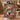 Couple holding a personalized Christmas musical woven blanket with custom family name woven in