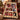 Personalized stamp collage family photo fleece throw draped over a red armchair