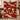 Holding a personalized Christmas Pudding Supper woven blanket with custom family name woven in